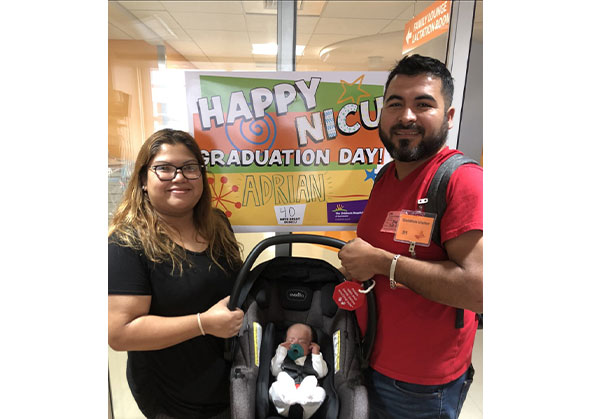 Adrian with his parents