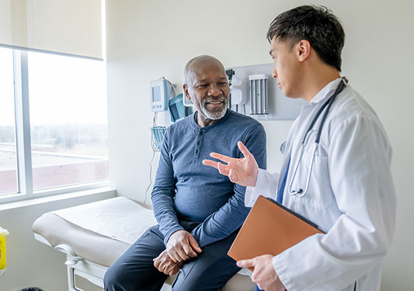 A family medicine doctor talking to a patient about improving their health. 