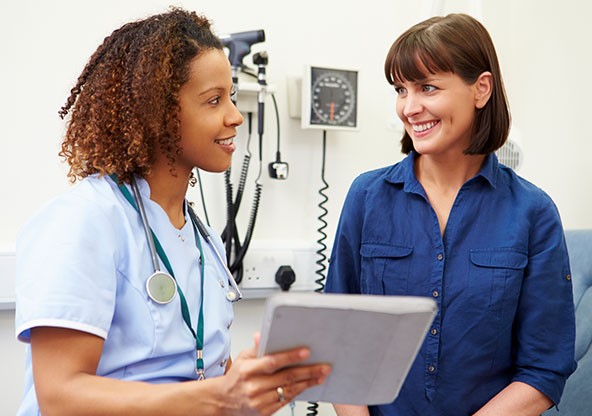 Doctor discuses surgery with patient.