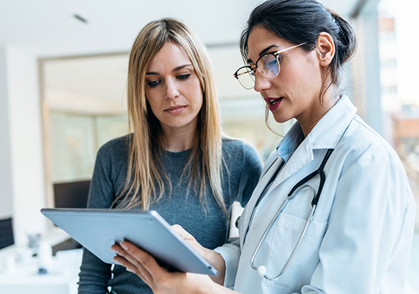 Woman consults with her doctor about her health. 